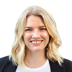 Head shot of Liz Marie, a blonde woman with a white shirt and black jacket